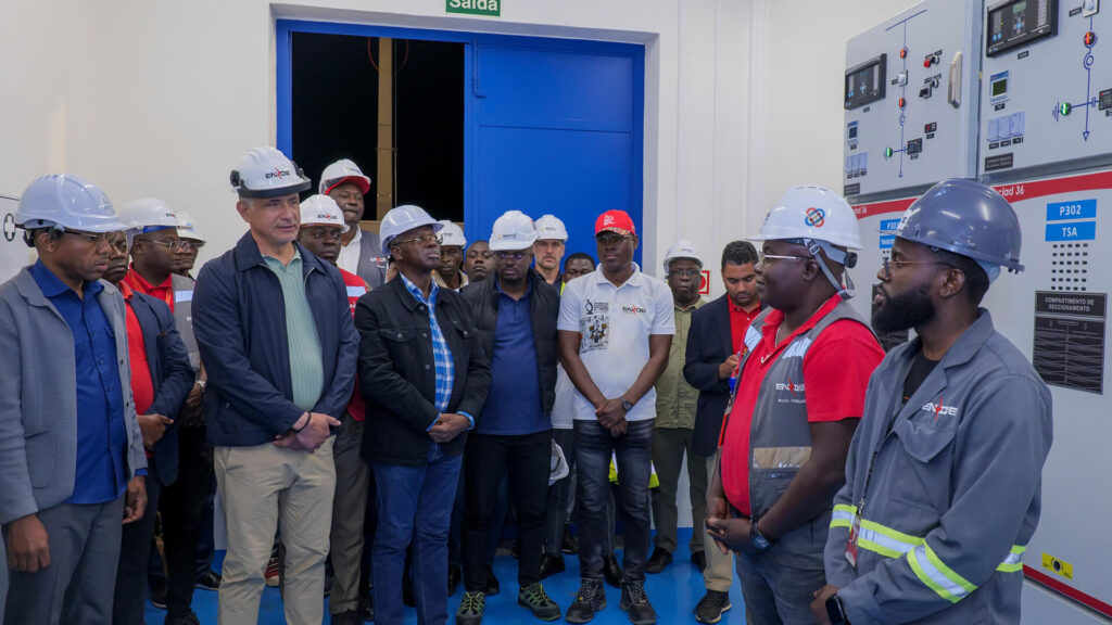 Group of people wearing hard hats in a utility room